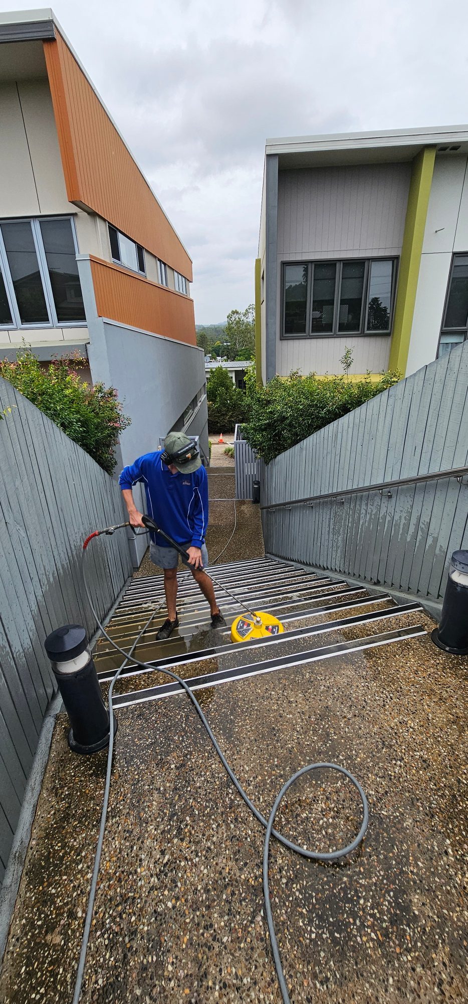Commercial concrete stairs being pressure washed