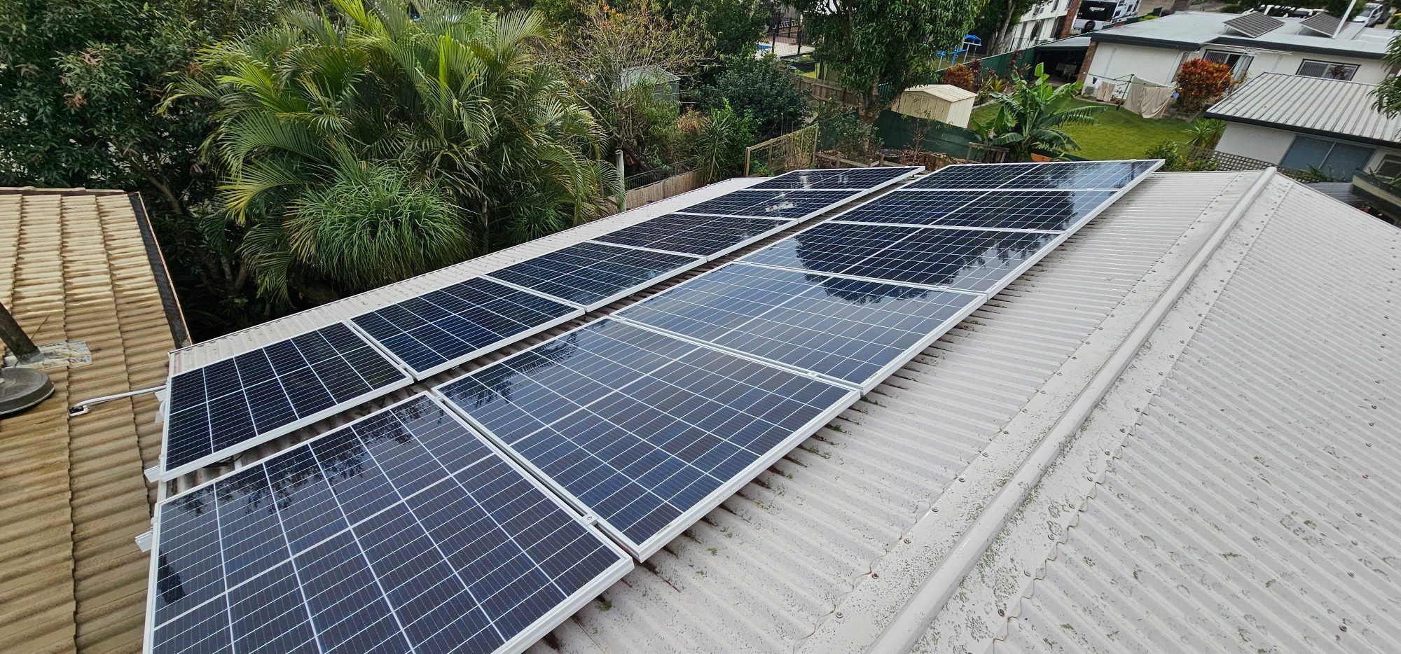 Aerial view of rooftops with solar panels